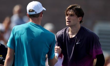 Jack Draper shakes hands after defeating Botic van De Zandschulp of the Netherlands in round three.