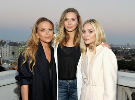 Olsen with her sisters Mary-Kate, left, and Ashley, right.