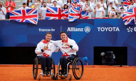 Alfie Hewett and Gordon Reid of Great Britain celebrate winning wheelchair doubles gold.