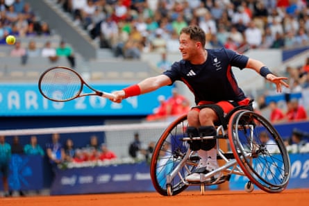 Great Britain’s Alfie Hewett stretches for a return against Japan's Tokito Oda during the men's singles gold medal match.