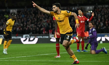 Mohamed Salah’s penalty sees off battling Wolves to send Liverpool top