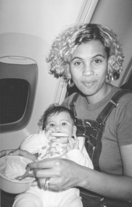 Neneh Cherry feeding her daughter Mabel on a plane while on tour, 1996.