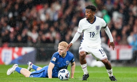 Angel Gomes wins the ball off Matti Peltola during the Nations League match between England and Finland