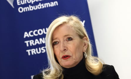 A blonde older woman with a sign behind her saying European ombudsman