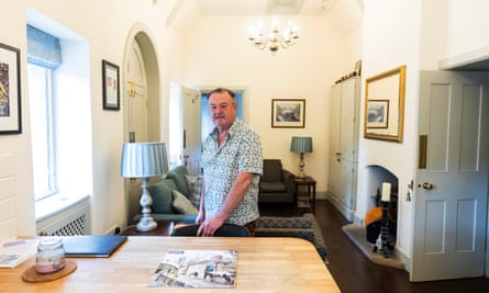 Tim Collis indoors in a living room