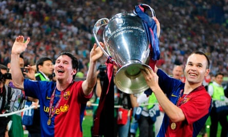 Lionel Messi, Andrés Iniesta and the Champions League trophy in 2009.