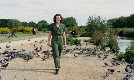 Elizabeth Sankey smiling and walking next to a river