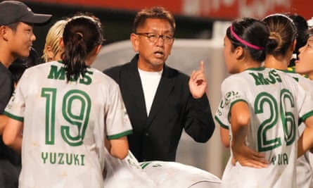 Takeo Matsuda, the Tokyo Verdy Beleza coach, addresses his players.