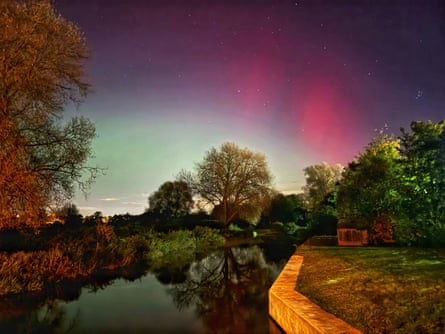 A colourful sky over a still river