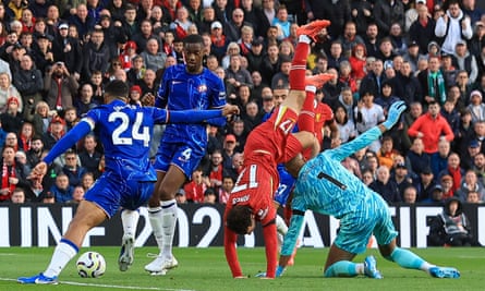 Curtis Jones is challenged by Chelsea’s Robert Sánchez