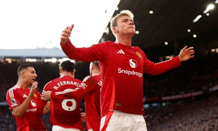 Rasmus Højlund celebrates in front of the Old Trafford crowd