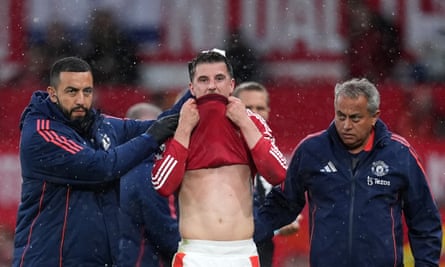 Manchester United’s Mason Mount leaves the pitch after picking up an injury against Tottenham