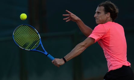 Diego Forlán hits a backhand during a match at the Carrasco Lawn Tennis Club in Montevideo, Uruguay