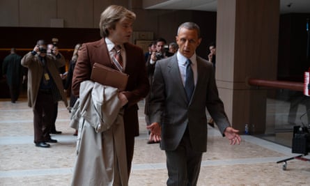 film still of two men in suits walking