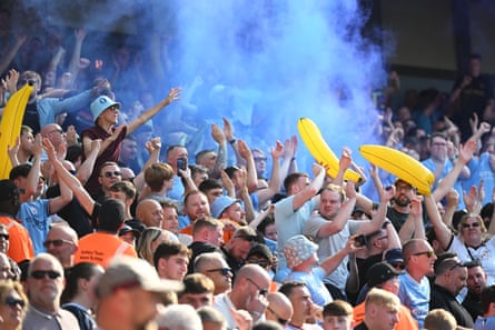 Manchester City fans wave inflatable bananas in May 2024