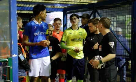 The two captains, Dean Woodman of Wealdstone (left) and Jay Robinson of Southampton (right), wait in the tunnel just before walking out for kick off in the National League Cup Group A match between Wealdstone and Southampton Under 21s.