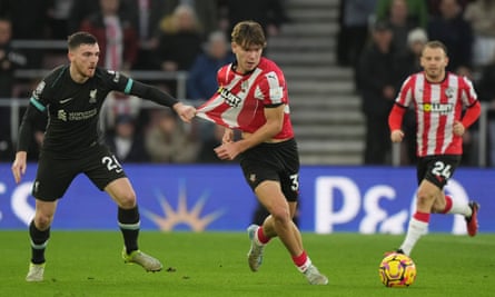 Liverpool’s Andrew Robertson holds the shirt of Southampton’s Tyler Dibling.