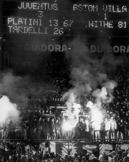 Juventus supporters, some holding flares, celebrate their second-leg win over Aston Villa.