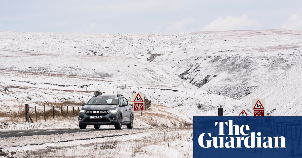 UK weather: snow and ice warning as commuters face widespread disruption