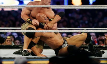 Dwayne Johnson on the wrong end of a chokehold in the ring in 2013.