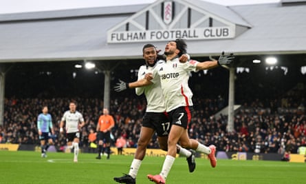 Fulham’s Raúl Jiménez celebrates with Alex Iwobi after scoring the opening goal