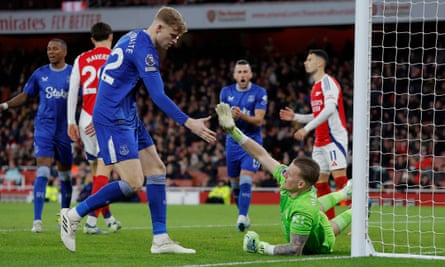 Everton keeper Jordan Pickford is congratulated by teammate Jarrod Branthwaite after making a brilliant save to deny Arsenal’s Bukayo Saka in the second half.