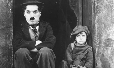 Charlie Chaplin and Jackie Coogan in The Kid.