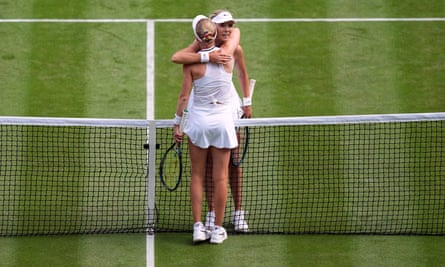 Katie Boulter and Harriet Dart embrace at the net after their second round Wimbledon match