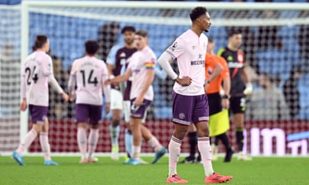 Ethan Pinnock looks dejected after Aston Villa score.