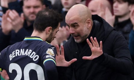 Pep Guardiola issues instructions on the touchline.