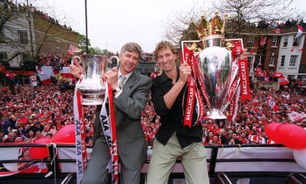 Arsenal manager Arsène Wenger and captain Tony Adams celebrate winning the FA Cup and Premiership in front of Arsenal’s fans.