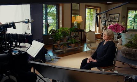 Martha Stewart sits in a living room with cameras in front of her