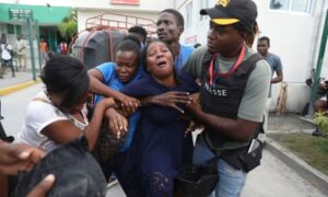 Two reporters and a police officer killed in shooting at Haiti hospital reopening