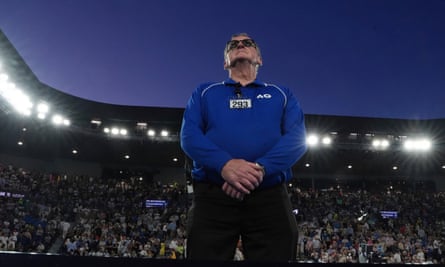 A security guard watches over Rod Laver Arena. Officials say crowd ejections have fallen in 2025.