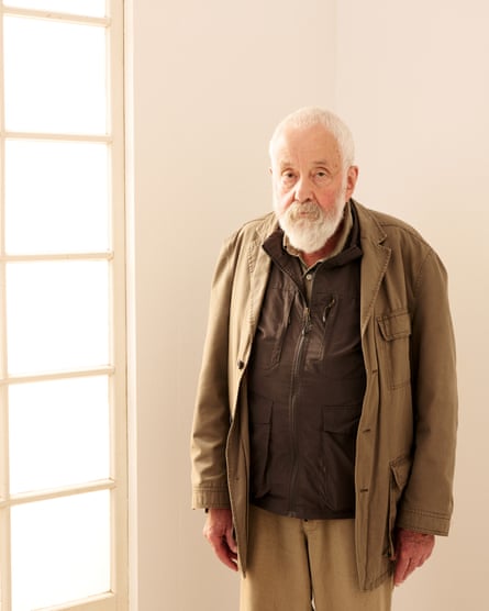 Mike Leigh standing by window