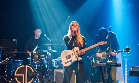 Performing with indie band Slow Club in London, 2014.