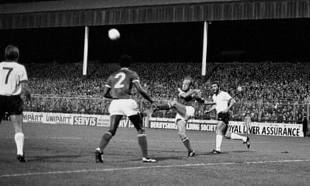 Nottingham Forest’s Archie Gemmill hacks the ball clear during his side’s 2-0 win in the 1978-79 European Cup watched by teammate Viv Anderson and Liverpool’s Kenny Dalglish (left) and Alan Kennedy (right)