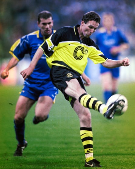 Borussia Dortmund’s Paul Lambert clears the ball as he is chased down by Juventus’s Zinedine Zidane during the 1997 Champions League final.