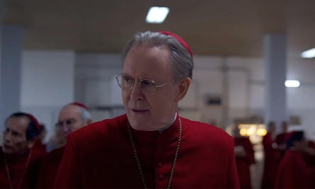 a man in red cardinals’ robes