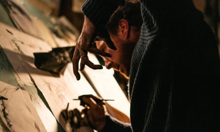 a man drawing pictures