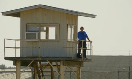 a man standing outside a watch tower