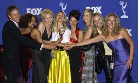 Liu (centre right) with Calista Flockhart and the cast of Ally McBeal at the Emmys in 1999.