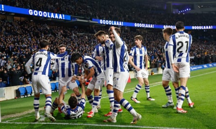 Ander Barrenetxea receives the acclaim from his teammates as he opens the scoring against Osasuna