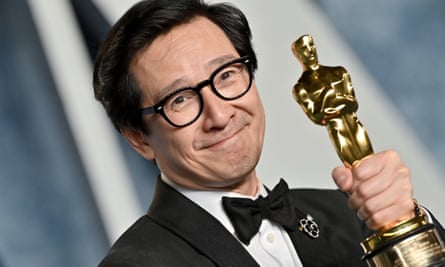 Quan with his Oscar for best supporting actor in Everything Everywhere All at Once.