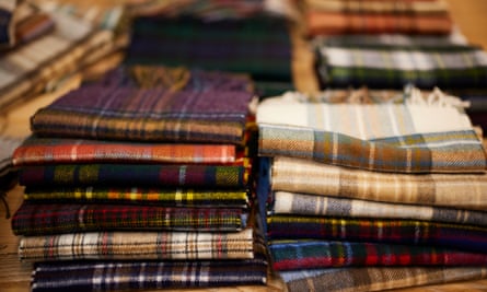 Pile of different tartan-style patterned wool.