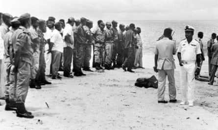 Gabonese soldiers and rescuers on a beach as divers search at sea for the bodies of Zambia players in 1993. Thirty people, including 25 players and officials heading to a World Cup qualifying match, were killed in the crash.