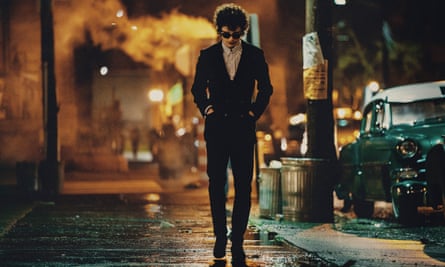 An actor as Bob Dylan walking down a street