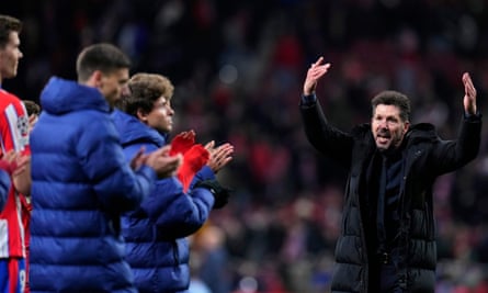 Diego Simeone gestures towards his players as they applaud the Atleti fans after the game