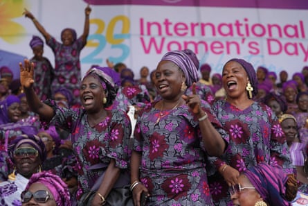 Women in purple smiling