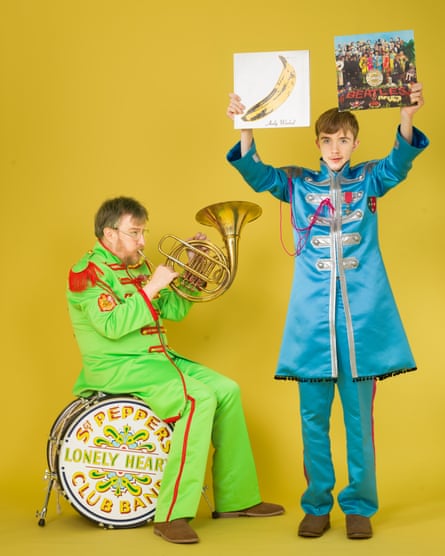 Portrait of John Harris and his son James in Sgt Pepper suits